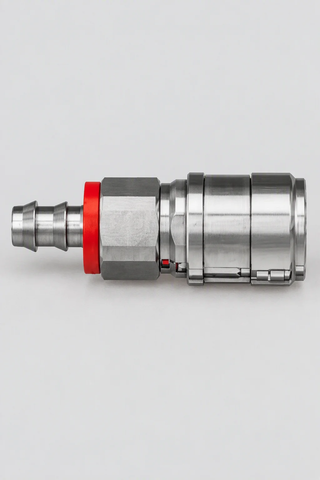A single stainless hose coupling with a barbed hose tail, photographed against a plain white background with a red sealing ring at its shoulder